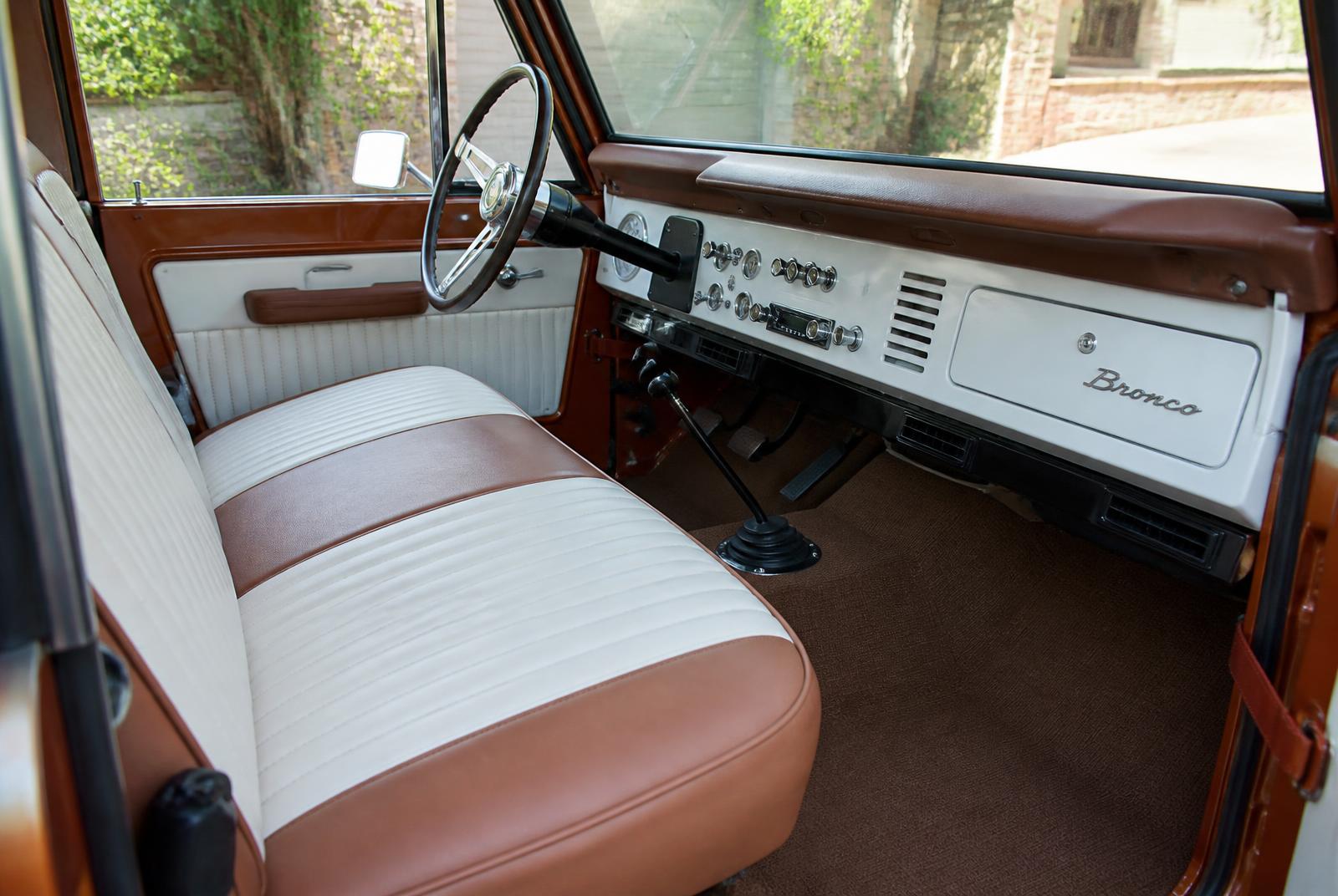 Restored Bronco interior with white and brown bench seat